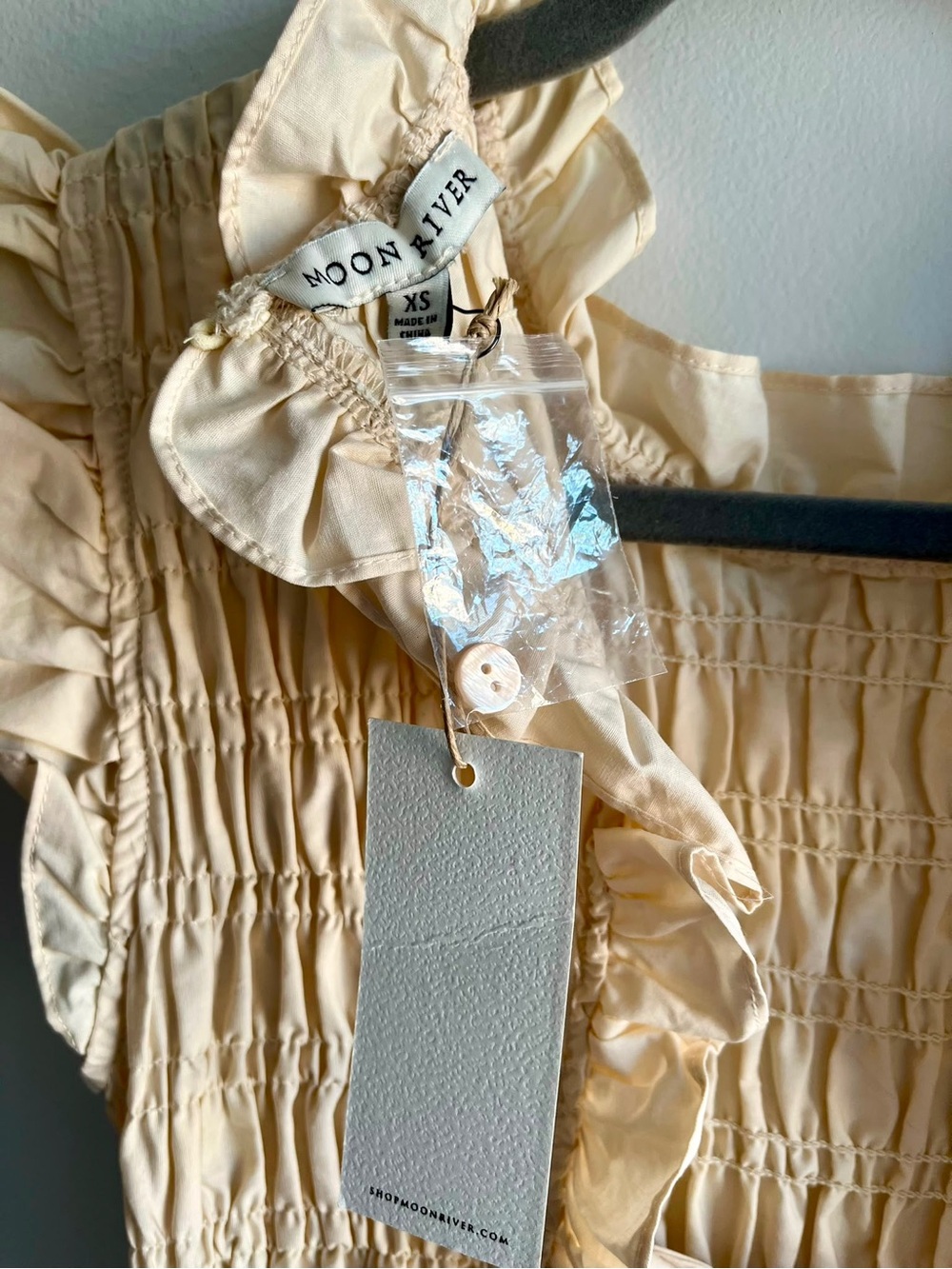 Moon River Lightweight Smocked Ruffle Top in Pale Cream